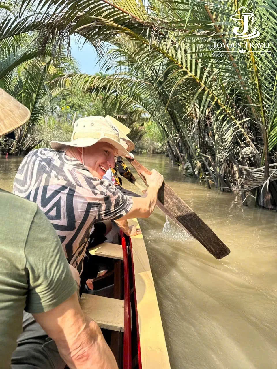 Paddling a sampan on the Mekong